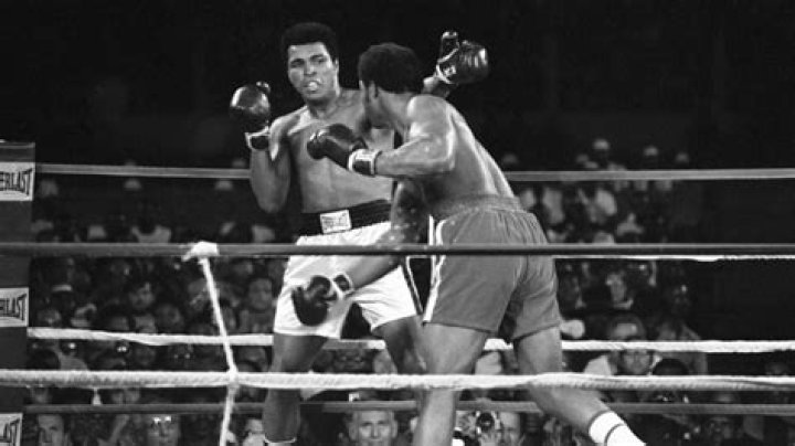 What was Muhammad Ali's record against George Foreman?