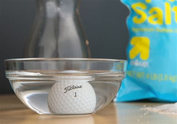 Why do some golf balls sink in water?